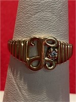 10 karat gold ring . Size 6 3/4.  Has a small CZ