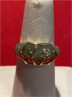 Jade ring with 14 karat gold setting. Size 8.