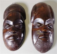 Pair African carved ebony faces