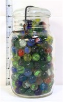 Clear fruit jar full of marbles