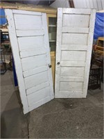 A pair of 30 inch vintage doors one is 76 1/2