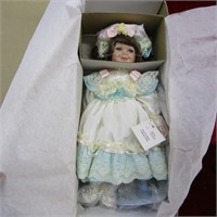 Marie Osmond porcelain doll. NIB.