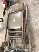 STACK OF METAL FOLDING CHAIRS