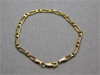 14K y gold figaro bracelet, 7 inches