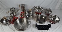 Collection of kitchenware including strainers and