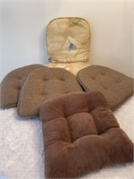 Chair pads, 1 brown, 3 are brown & tan