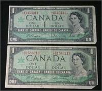 Two 1967 Asterix note Canada $1 Bills