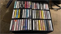 Two sided cassette case packed full of cassettes