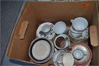 box of teacups and saucers
