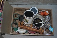 crate of candle warmers, candles, tea light holder