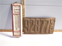 Elmer Prins thermometer and old license plate
