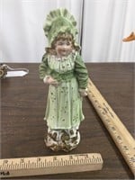 Doll Statue in green dress, back is not colored
