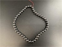 String of 1/4in hematite beads 16in long, no clasp