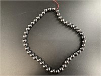 String of 1/4in hematite beads 16in long, no clasp