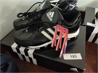 New pair Adidas men's cleats, size 10