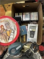 cassette tapes, flashlight, sander, tach meter