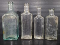 Four vintage glass jars