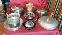 4 fry pans, metal water container, 2 chili pots