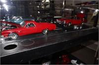2 Die Cast Cars in Display