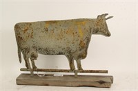 TIN COW ON WOODEN STAND