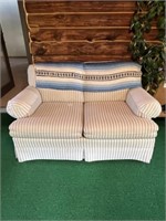 cream and striped loveseat with blanket 60"x36"