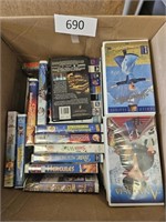 Box of VHS tapes W/ VCR untested