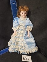 Porcelain doll in a blue dress 14" (j.m)