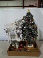 Silver Santa, small lighted Christmas tree and