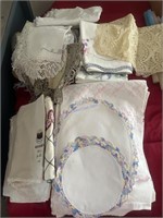Embroidered pillow cases, doilies table cloths