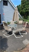 Patio table with umbrella and 6 chairs