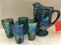 Blue Carnival glass pitcher with 4 tumblers