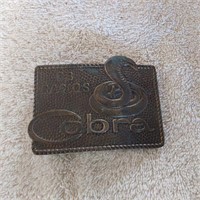 Cobra cb radio's belt buckle