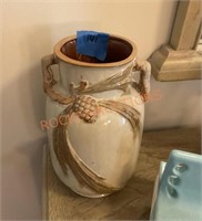 Decorative vase with pinecone details