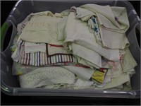 Container of linens: curtains, dish towels,