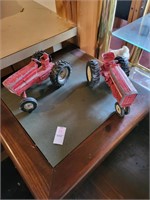 2 metal toy tractors