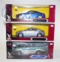 Three Boxed Road Legends die cast model cars