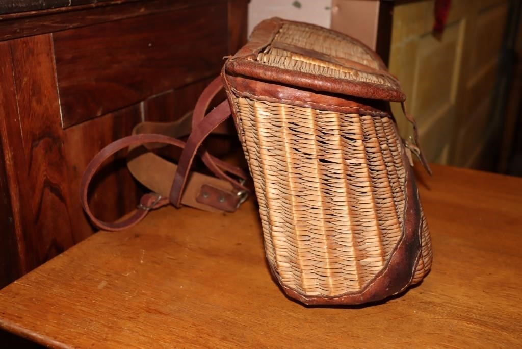 Stone Creek creel basket with strap and a Fly