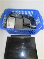 Mini Laptop and Basket of Various Phones