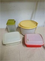 4 vintage Tupperware containers with lids