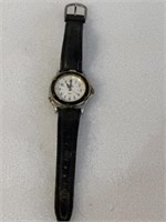 Vintage Timex, with black black leather band,