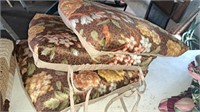 Three floral print cushions