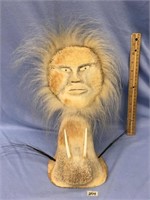 14" fossilized bone carving of a man, with inset i