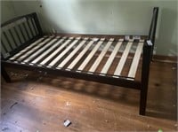 Dark brown wooden twin bed frame