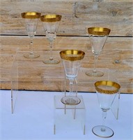 FIVE ANTIQUE FLUTED WINE GLASSES