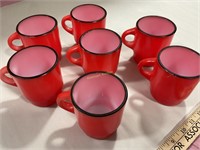 7 Fire King stacking mugs, red