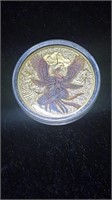 Gold tone Phoenix coin