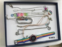 LOT OF RAINBOW NECKLACES AND A WATCH
