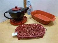 2 Cast Trivets / Red Casserole / Tea Pot