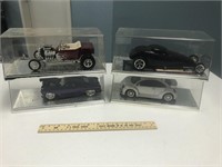 4 Die Cast Model Cars in Display Cases