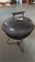 Charcoal grill proximately 21 in tall 15 in wide